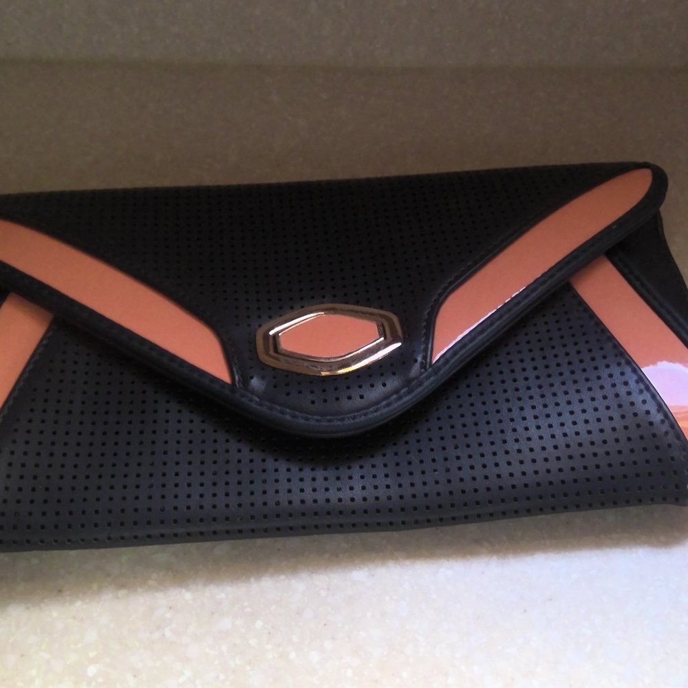 STREET LEVEL NAVYCLUTCH WITH PEACH PATENT LEATHER TRIM